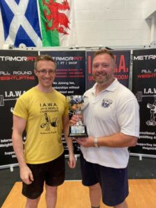 Mark Haydock receiving the Health & Strength Trophy from promoter Paul Barette